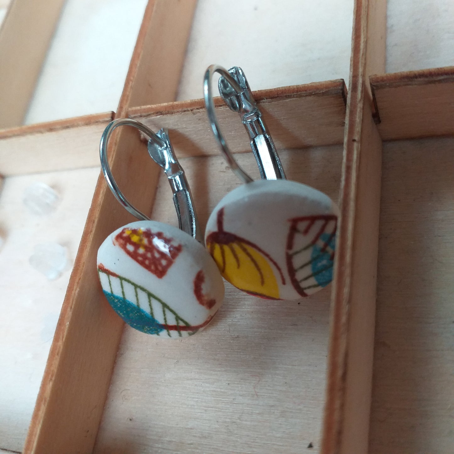 Earrings ceramic with lever back fitting.